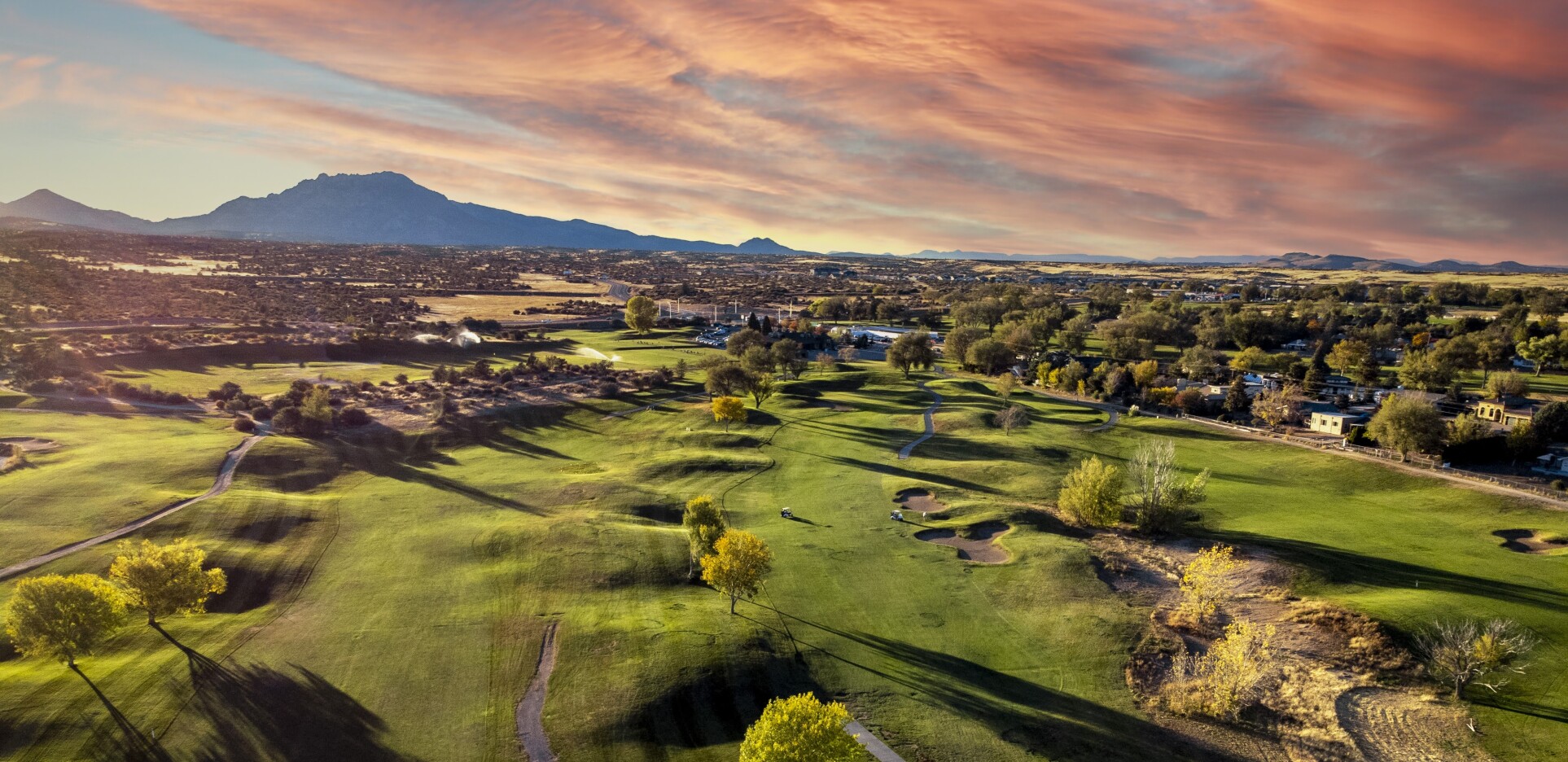 View of golf course at sunset
